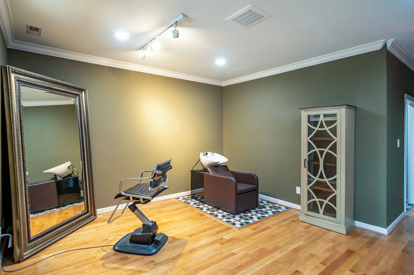 The upstairs room toward the mirror and cabinet.